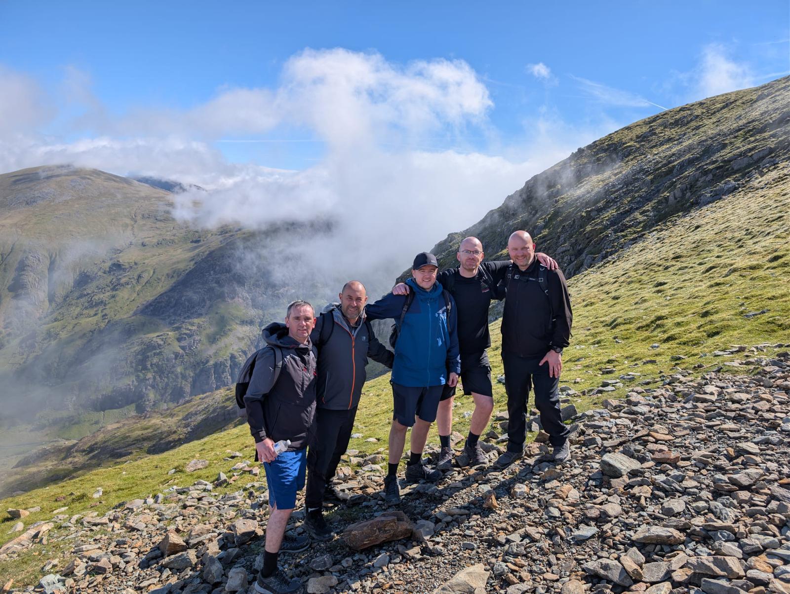 A well-earned team photo during the Snowdon climb